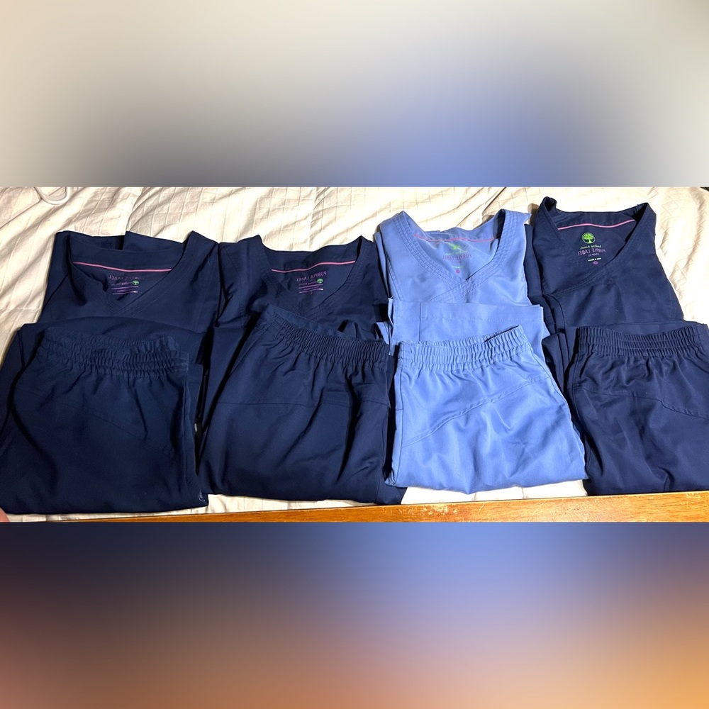 Four pairs of Purple Label Healing Hand scrubs size large